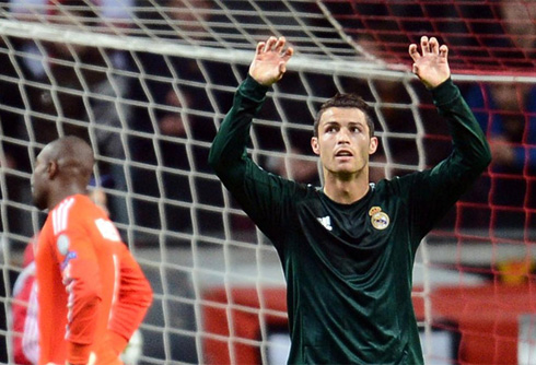 Cristiano Ronaldo doing the claw celebration in a Real Madrid green jersey at the UEFA Champions League 2012-2013