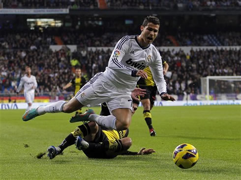 Cristiano Ronaldo being brought down after a harsh tackle, in Real Madrid vs Zaragoza for La Liga 2012-2013