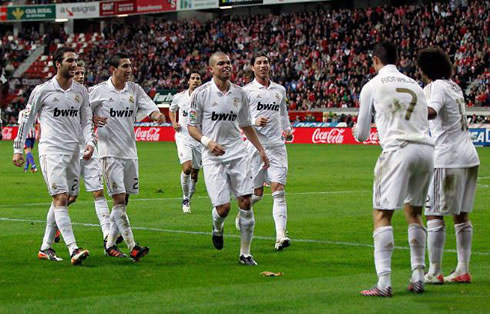 Cristiano Ronaldo and Marcelo dancing, while their teammates join them