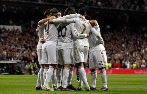 Real Madrid players hug each other in the Santiago Bernabéu, as Real Madrid crashes Espanyol by 4-0