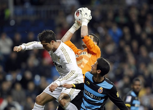 Cristiano Ronaldo jumping and charging over the goalkeeper