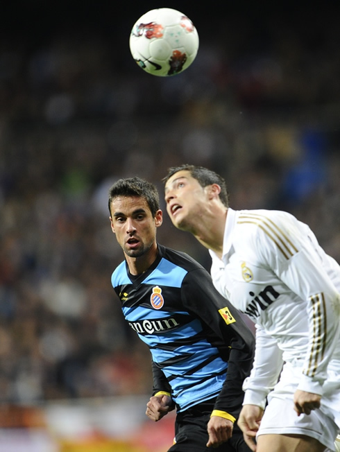 Cristiano Ronaldo heading the ball and looking above