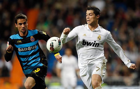 Cristiano Ronaldo running near an Espanyol defender
