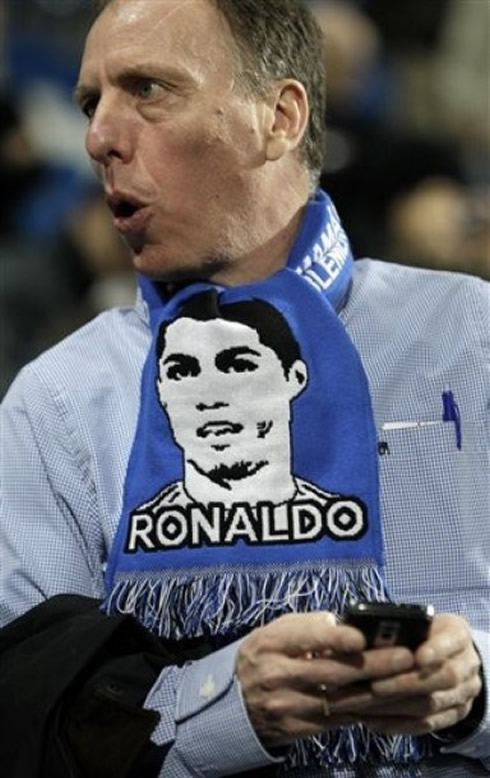 A Real Madrid supporter using a Cristiano Ronaldo scarf at the Santiago Bernabéu