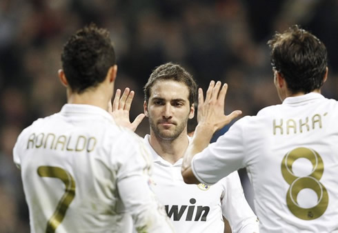 Cristiano Ronaldo and Kaká go congratulate Gonzalo Higuaín for his long awaited Real Madrid goal