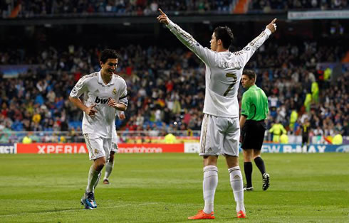 Cristiano Ronaldo stretching his two arms sideways, as he waits for Nuri Sahin to celebrate Real Madrid goal in 2012
