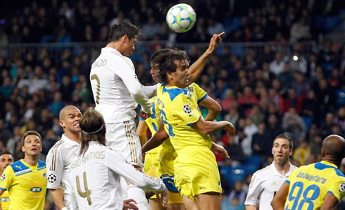 Cristiano Ronaldo heading the ball at a very high point in the air