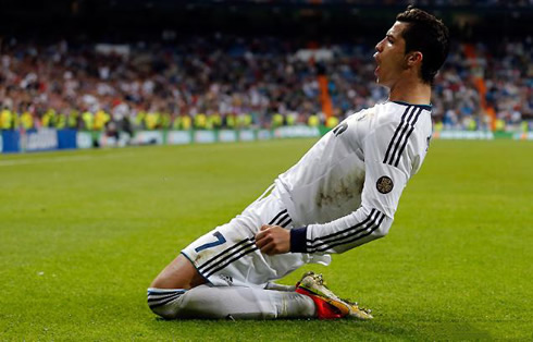 Cristiano Ronaldo slides on his knees to commemorate his goal for Real Madrid, in 2013