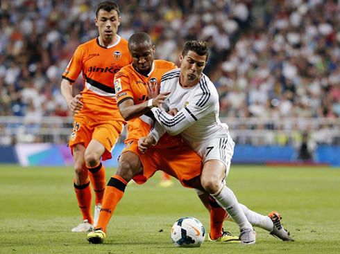 Cristiano Ronaldo being pushed by a defender in Valencia vs Real Madrid for the Spanish League