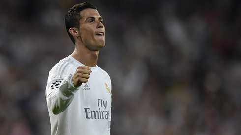 Cristiano Ronaldo raising his right arm to celebrate Real Madrid's victory
