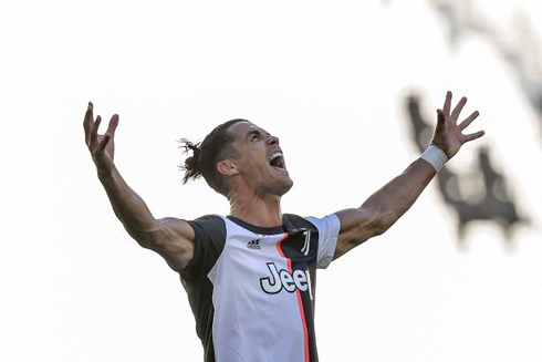 Cristiano Ronaldo opening his arms and screaming of joy after scoring for Juventus