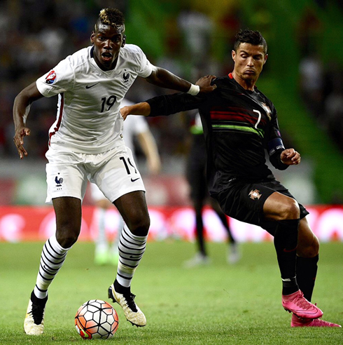 Paul Pogba and Cristiano Ronaldo, in a Portugal vs France in 2015