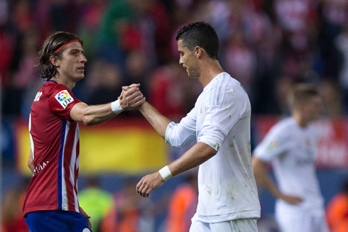 Filipe Luís and Cristiano Ronaldo salute each other in the derby between Atletico Madrid and Real Madrid