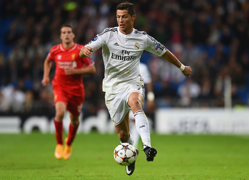 Cristiano Ronaldo playing for Real Madrid in a UEFA Champions League fixture against Liverpool in 2014-2015