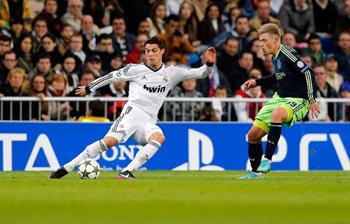 Cristiano Ronaldo unusual body stance to make either a cross or a shot, in Real Madrid vs Ajax for the UEFA Champions League, in 2012-2013