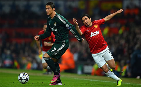 Cristiano Ronaldo dribbling and leaving Rafael da Silva behind him, in Manchester United vs Real Madrid, for the Champions League second leg in 2013