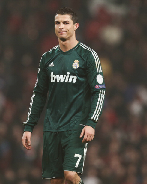 Cristiano Ronaldo releasing a shy smile at Old Trafford, in Manchester United 1-2 Real Madrid, in 2013