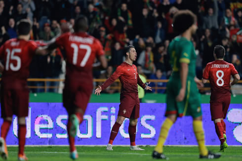 Cristiano Ronaldo with his arms open, open for his teammates from the Portugal National Team to join him in the goal celebrations