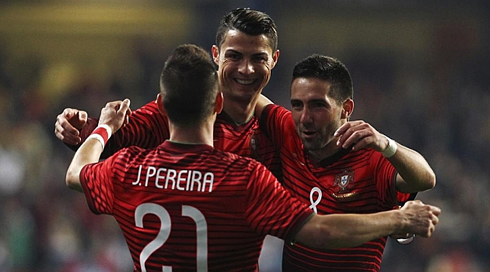 Cristiano Ronaldo hugging João Pereira and João Moutinho in Portugal's 5-1 win over Cameroon