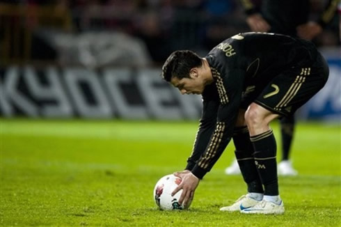 Cristiano Ronaldo setting the ball on his preferred spot, before taking a penalty-kick for Real Madrid, in La Liga 2012