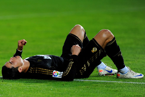 Cristiano Ronaldo layed down on the ground with his chest up and acting almost as if he was dead, during a Real Madrid game in 2012