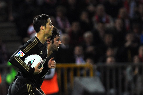 Cristiano Ronaldo holding the ball under his arm and getting back to his half, in La Liga 2012