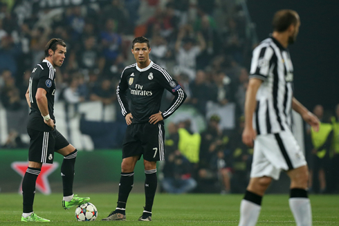Gareth Bale and Cristiano Ronaldo waiting to resume the game after Juventus goal