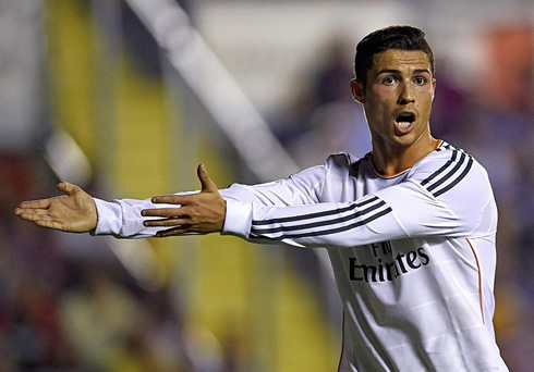 Cristiano Ronaldo using his two arms to point something to the referee