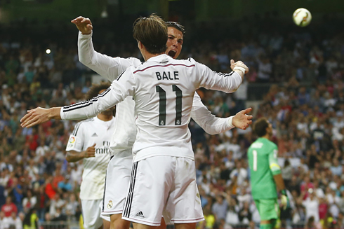 Cristiano Ronaldo and Gareth Bale clashing their chests agaisnt each other