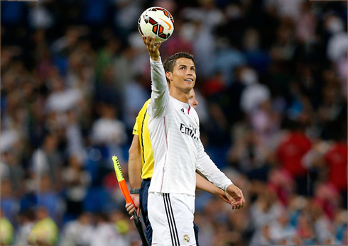 Real Madrid holding the hat-trick ball with his hand, as he takes it home to put it in his museum