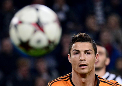 Cristiano Ronaldo looking at the UEFA Champions League ball, in 2013-2014