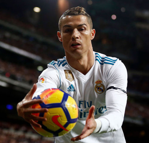 Cristiano Ronaldo grabbing the ball near the TV cameras