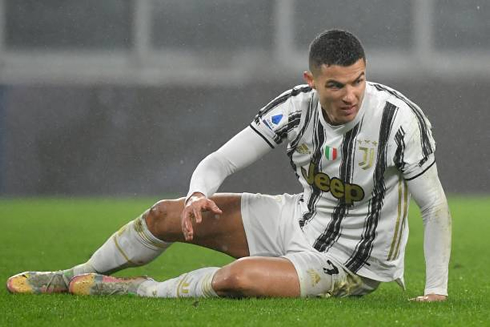 Cristiano Ronaldo down on the ground after suffering a foul