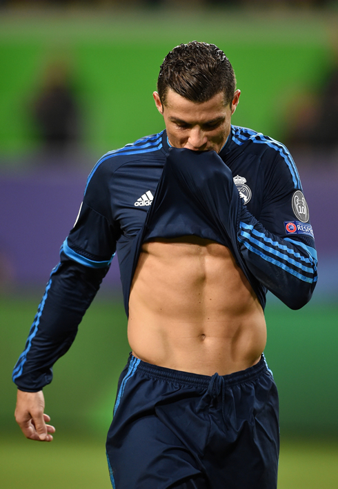 Cristiano Ronaldo showing his abs by pulling his shirt up during a game in 2016
