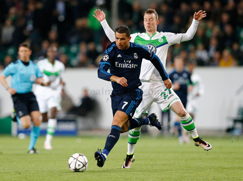 Cristiano Ronaldo running in front of an opponent from Wolfsburg, in their Champions League tie in 2016