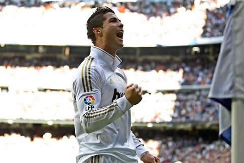 Cristiano Ronaldo celebrates close to the corner flag, at the Santiago Bernabéu