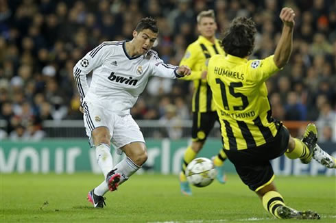 Cristiano Ronaldo right foot strike in Real Madrid vs Borussia Dortmund, with Hummels trying to block it in a slide, in 2012-2013