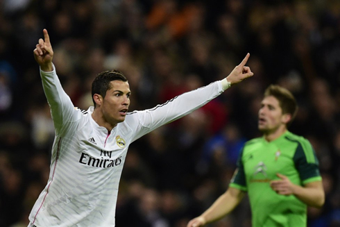 Cristiano Ronaldo lifts his two hands to celebrate a record-breaking hat-trick in Spain