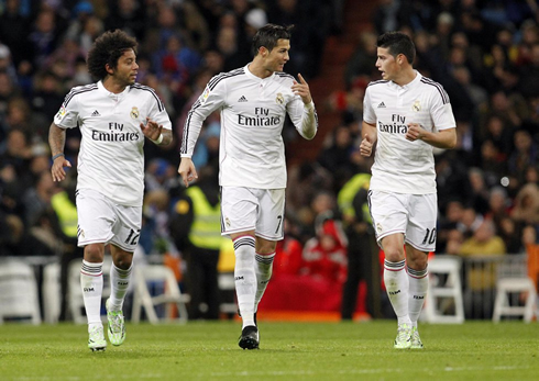 Cristiano Ronaldo talking with James Rodríguez and Marcelo during a Real Madrid home league game