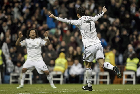 Cristiano Ronaldo running towards Marcelo after netting his 23rd league hat-trick in Spain