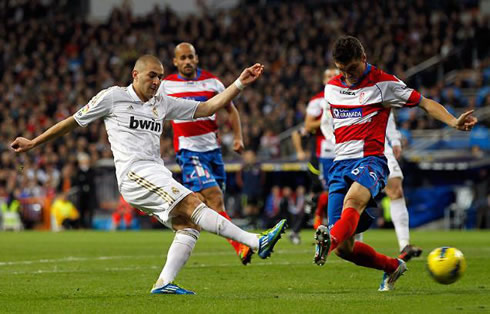 Karim Benzema striking another to the back of Granada's net