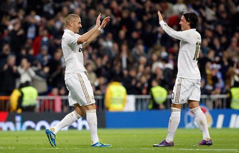 Karim Benzema and Mesut Ozil smiling and celebrating a Real Madrid goal together