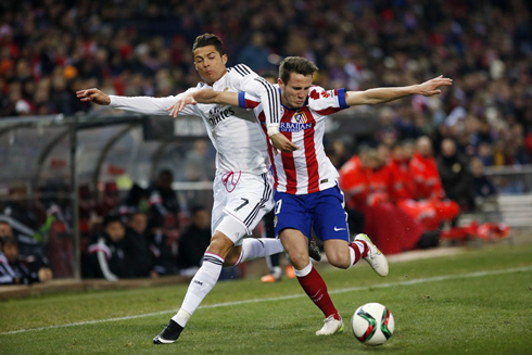 Cristiano Ronaldo arm struggle with an Atletico defender, in the Copa del Rey 2015