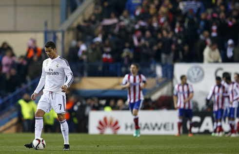 Cristiano Ronaldo taking the ball back to the half line, in order to resume the game after Real Madrid conceded a goal