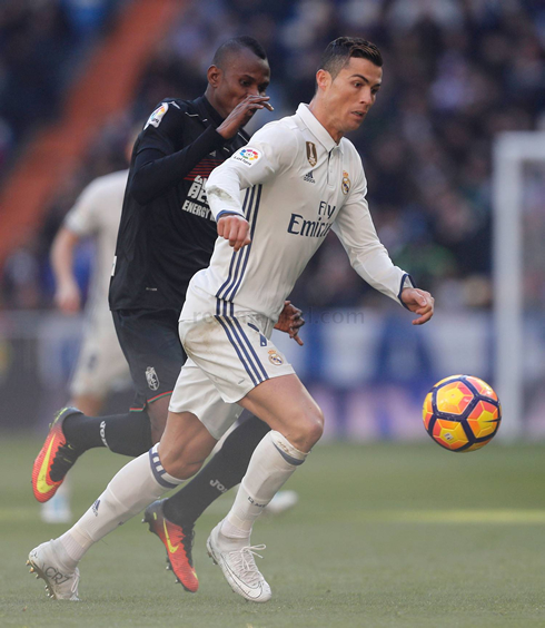Cristiano Ronaldo chased by a defender in Real Madrid vs Granada for La Liga in 2017
