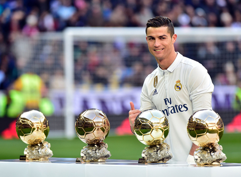 Cristiano Ronaldo displaying his 4 Ballon d'Ors at the Bernabéu in front of Real Madrid fans
