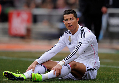 Cristiano Ronaldo seated on the ground at the Vicente Calderón