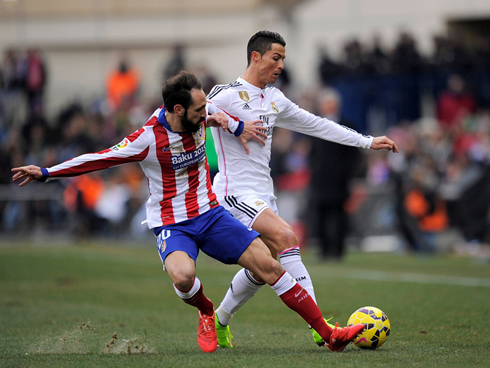 Juanfran tackling Cristiano Ronaldo in the league derby