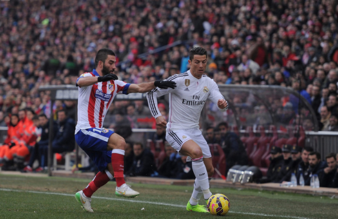 Cristiano Ronaldo getting past Arda Turán in the Atletico vs Real Madrid derby