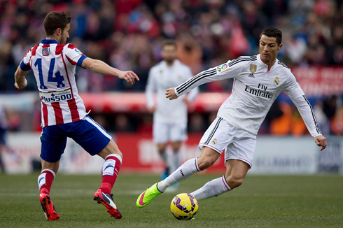 Cristiano Ronaldo dribbling Gabi, in Atletico Madrid vs Real Madrid for the Spanish League in 2015